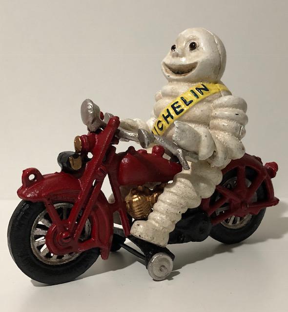 Cast Iron Ornament Michelin Man on Red Motorcycle like Harley Davidson Cast Iron Ornament Michelin Man on Red Motorcycle like Harley Davidson